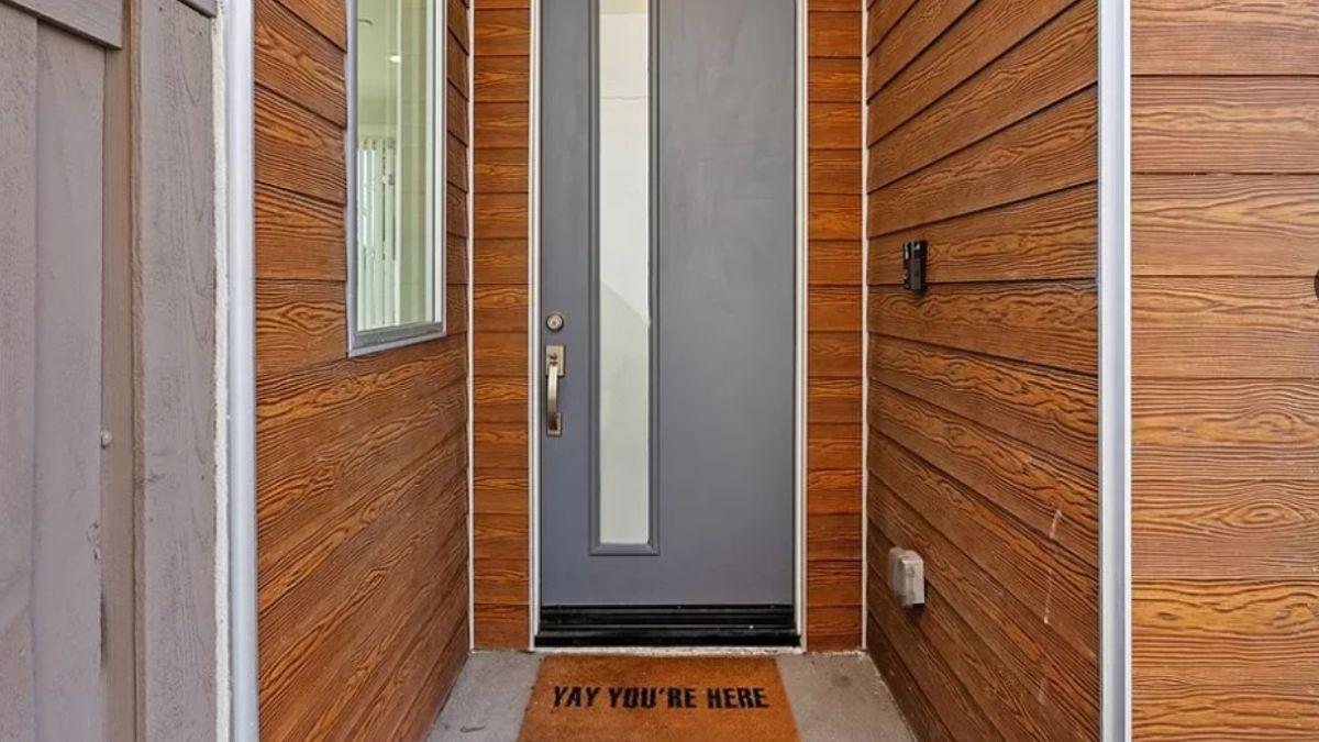 Welcome Home to a Chic Entrance with Bold Wood Siding