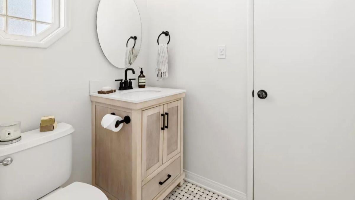 Compact Powder Room with a Charming Hexagonal Window