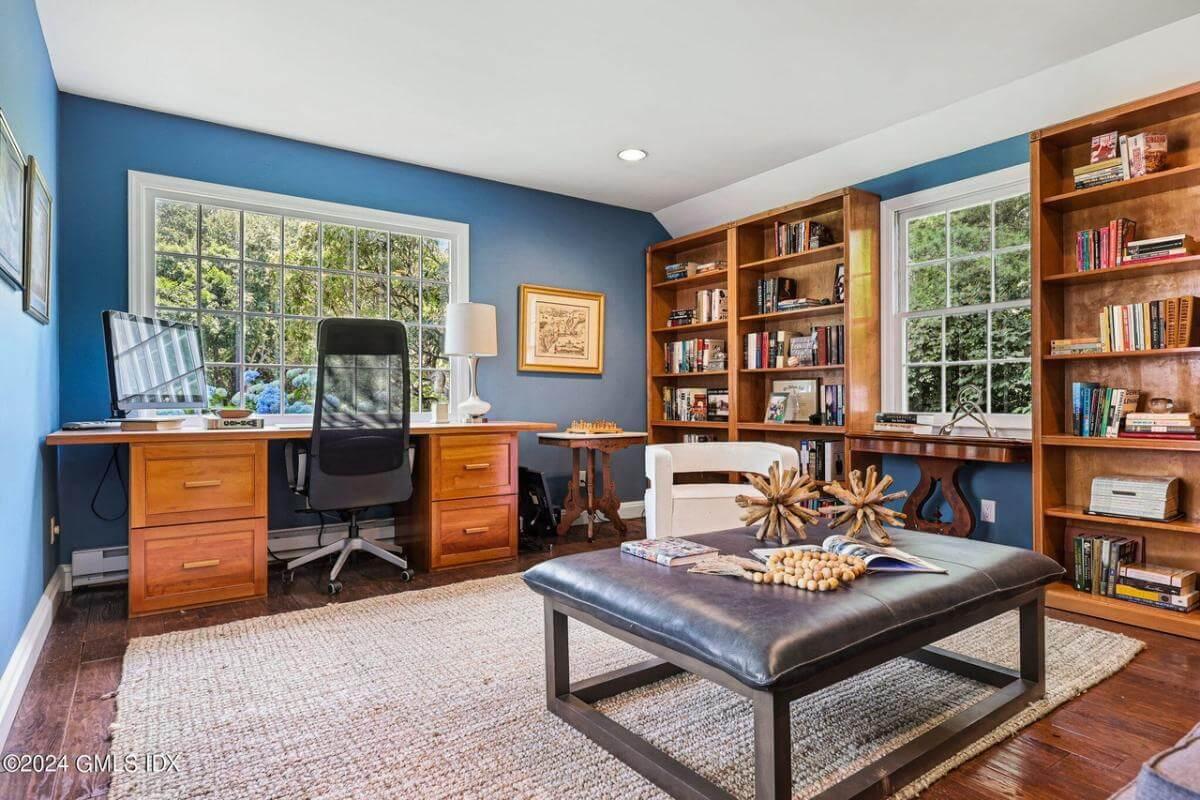 Embrace Productivity in This Home Office with Blue Walls and Built-In Bookshelves