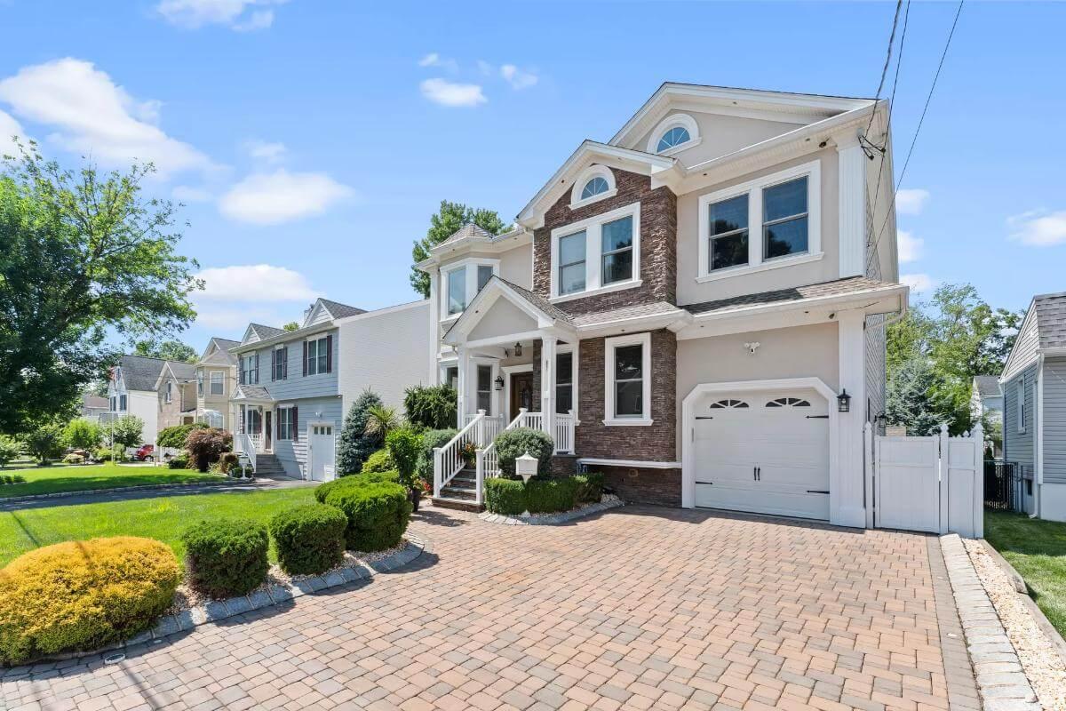 Classic facade with Distinctive Brick Detailing and a Manicured Drive