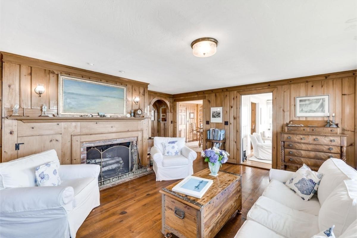 Embrace the Warm Nostalgia of Knotty Pine Walls with a Rustic Fireplace