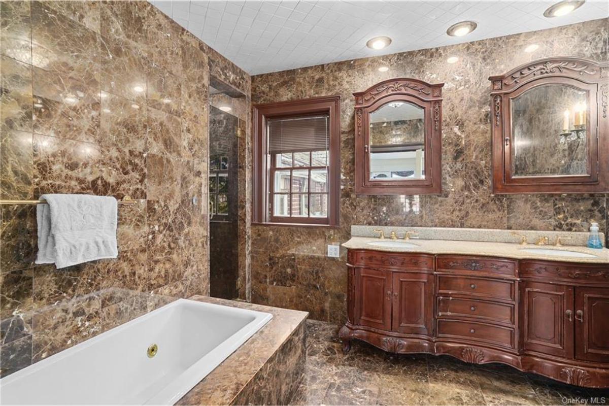 Luxurious Marble Bathroom Featuring Exquisite Dual Vanities
