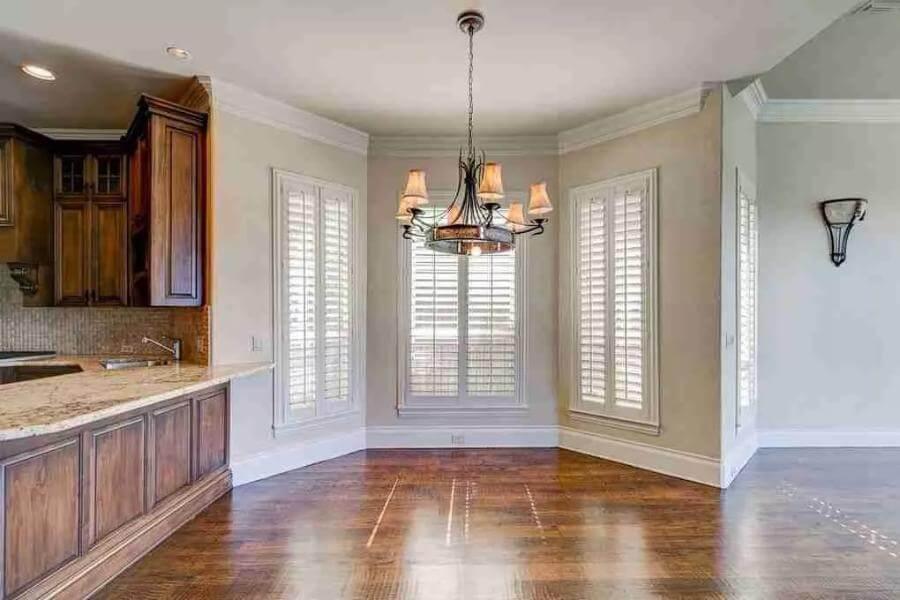 Breakfast Nook with Plantation Shutters and a Classic Chandelier