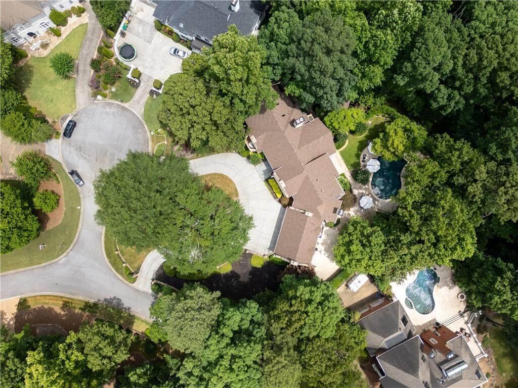 Aerial View Showcasing Lush Surroundings and Inviting Pool