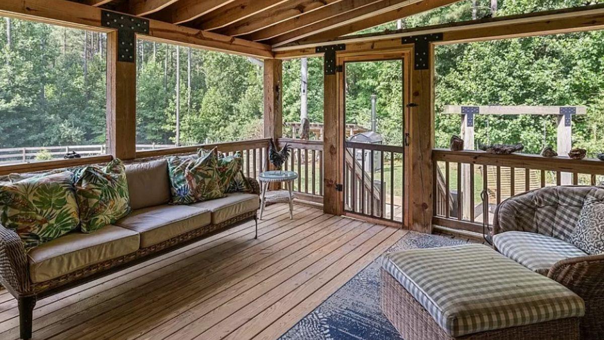 Relax on This Screened Porch with Rustic Wood Features