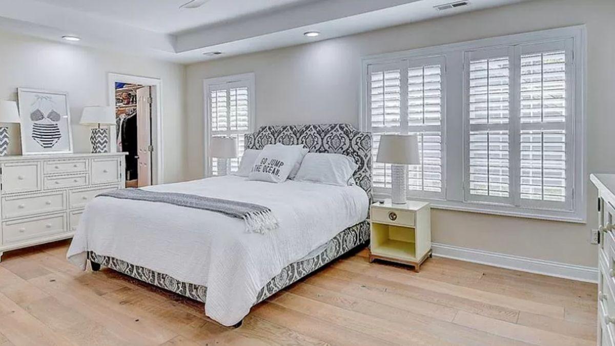 Craftsman Bedroom with Elegant Headboard and Plantation Shutters