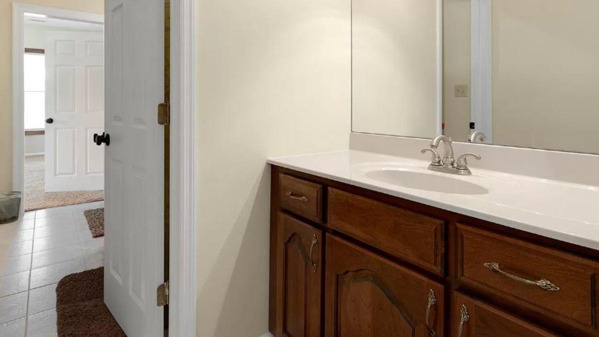 Functional Bathroom with Warm Wood Vanity