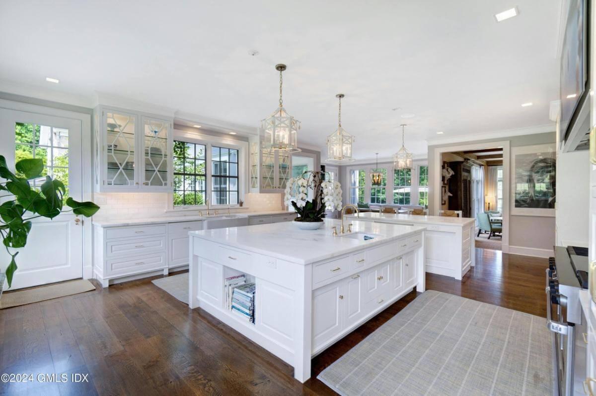 Marvel at the Light-Filled Kitchen with Dual Islands