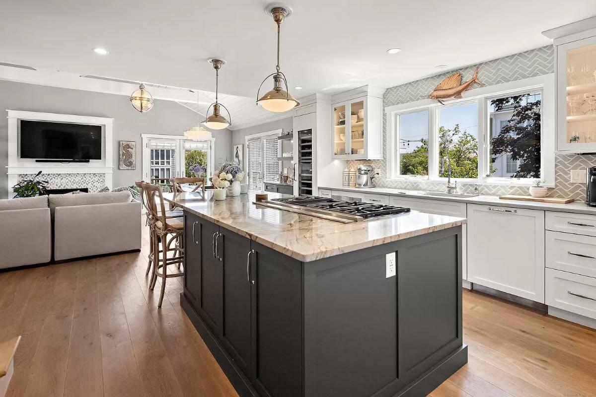 Consider the Expansive Island and Coastal Details in This Open Kitchen