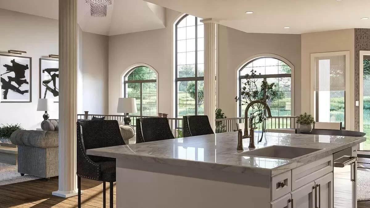 Admire the Vaulted Ceilings and Marble Island in This Light-Filled Kitchen