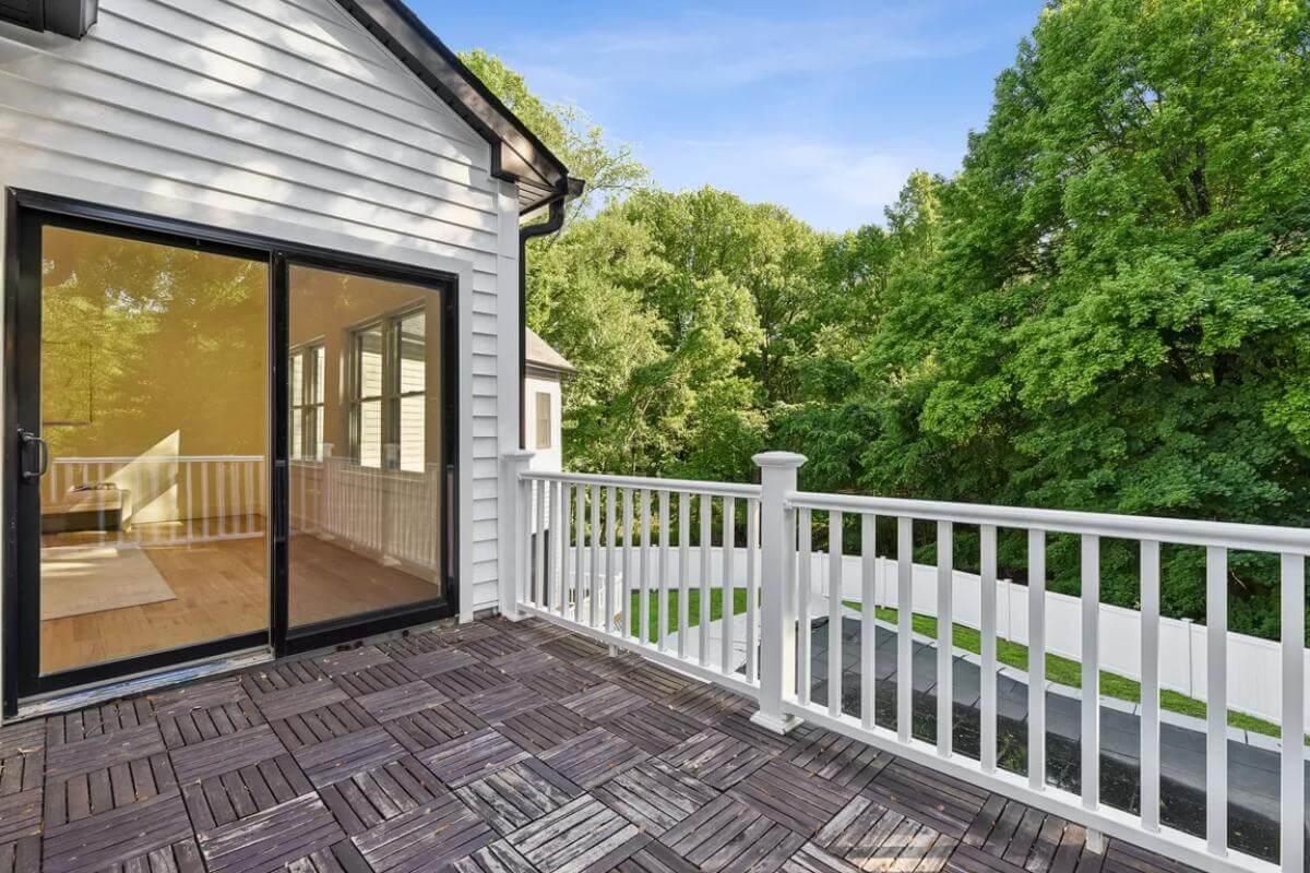 Step Out onto This Balcony with Natural Wood Tiles and Scenic Views