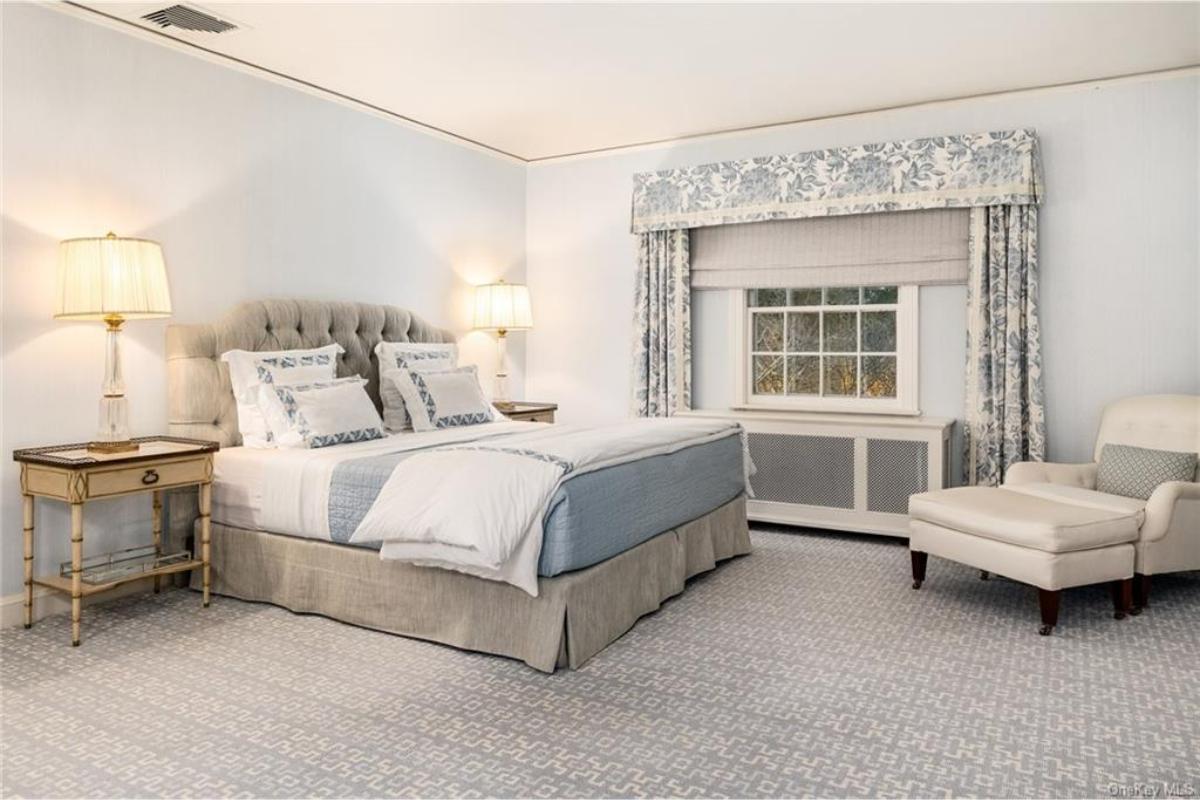 Serene Bedroom with Soft Blue Accents and Tufted Headboard