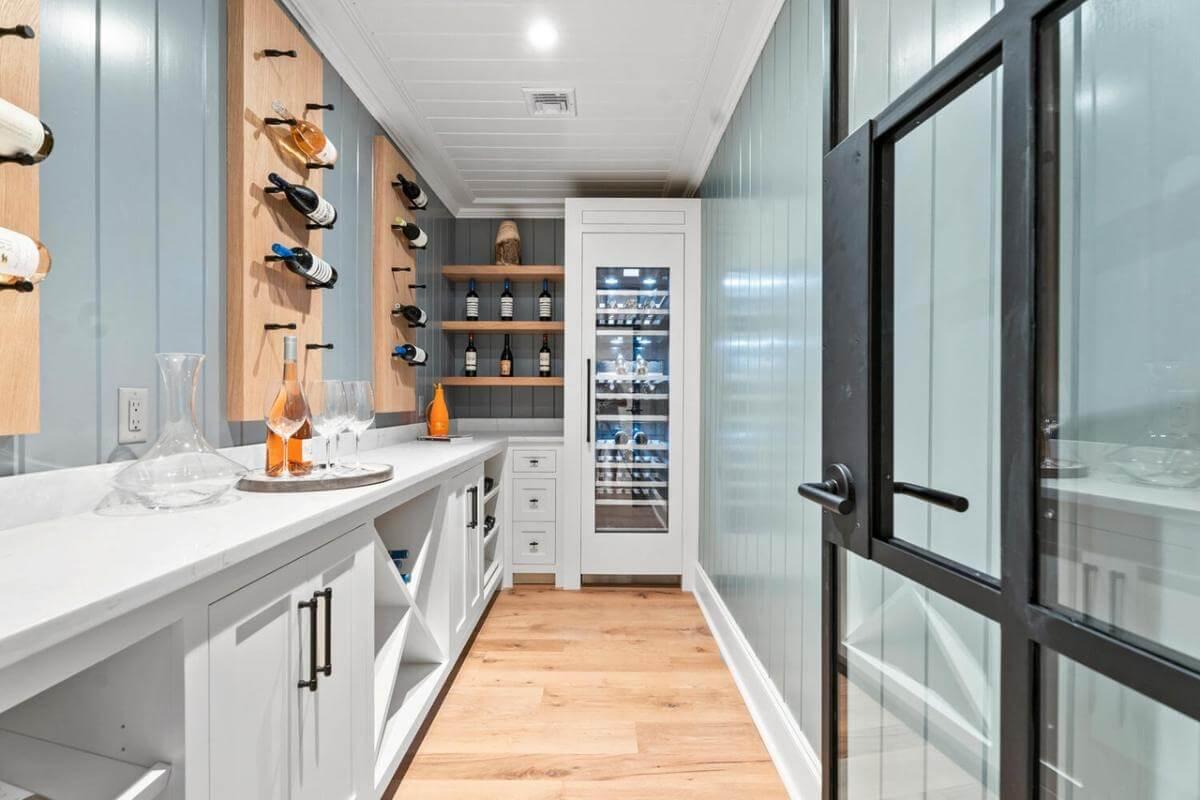 Step Into the Elegant Craftsman Wine Room with Sleek Glass Door