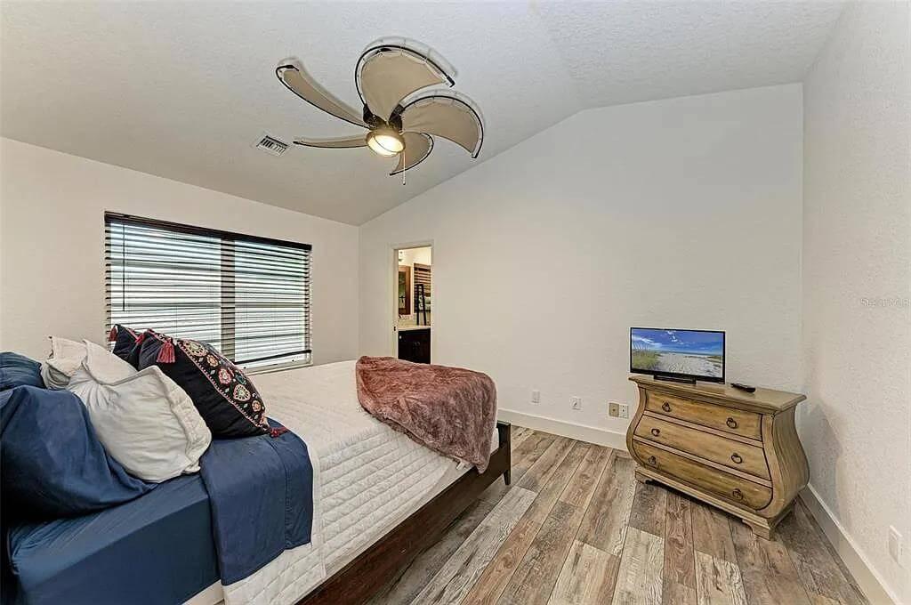 Cozy Bedroom with Unique Fan and Warm Textures