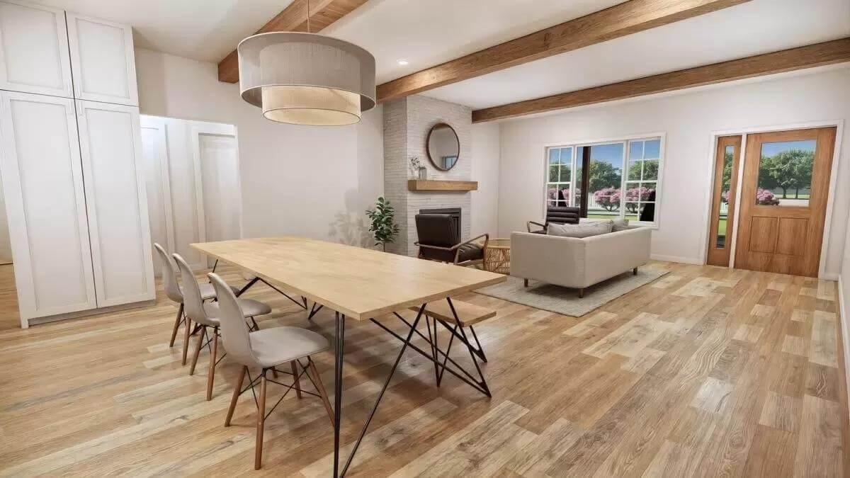 Explore This Open Dining and Living Space Featuring Exposed Wooden Beams