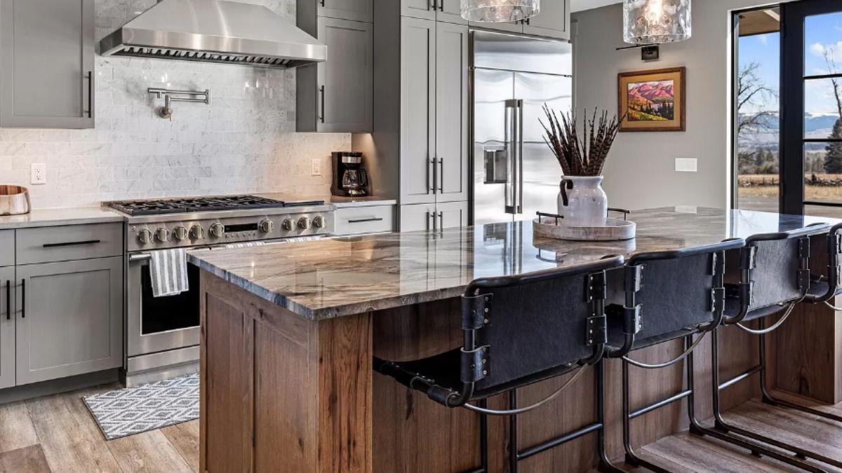 Explore the Minimalist Charm of This Kitchen Island with Leather Stools