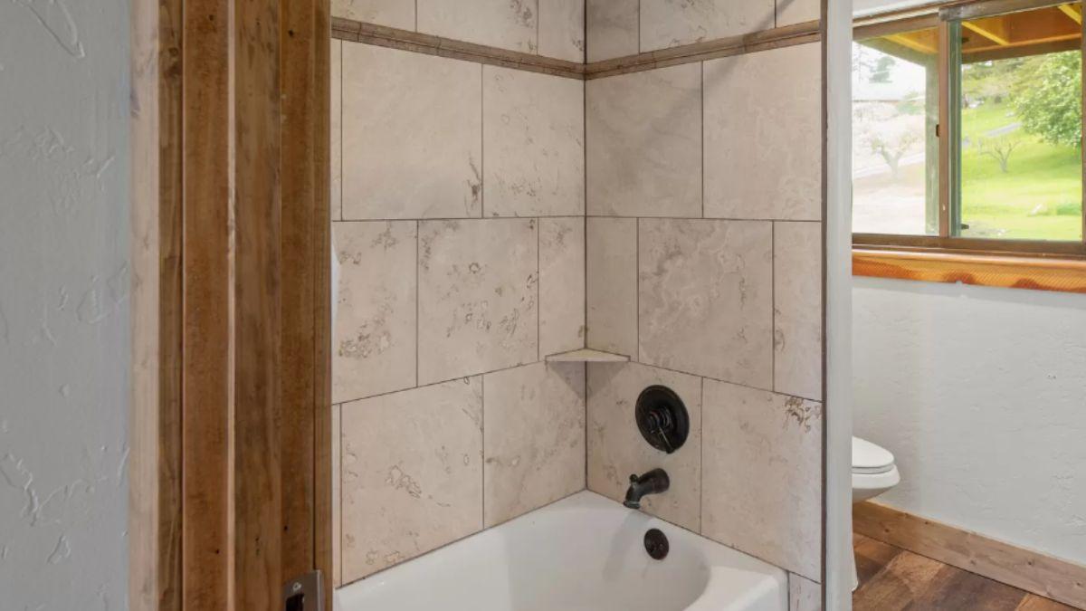 Subtle Rustic Charm with Tiled Shower Niche