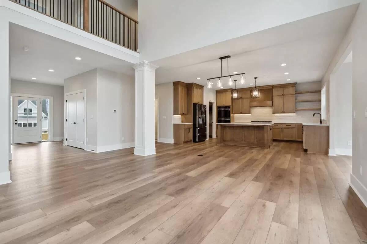 Check Out the Spacious Open-Concept Kitchen with Sleek Lighting