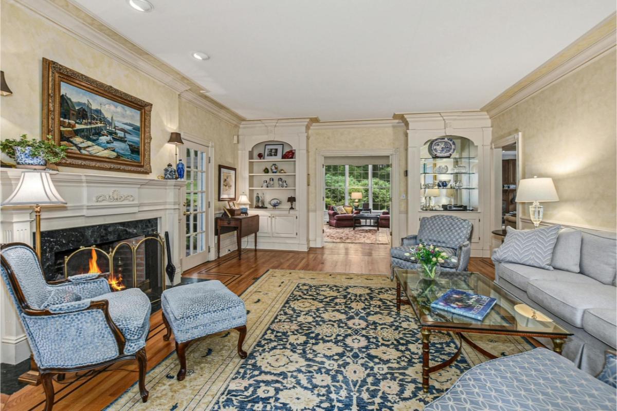 Check Out the Ornate Fireplace in This Traditional Living Room