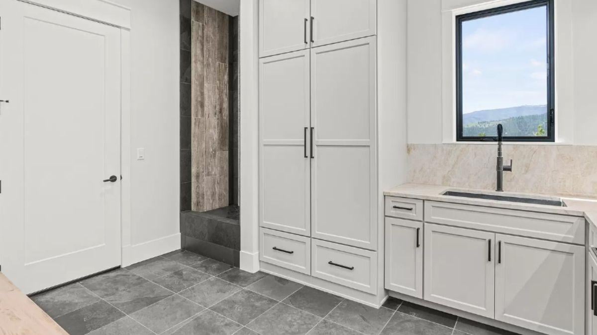 Spot the Sleek Storage Solutions in This Modern Laundry Room