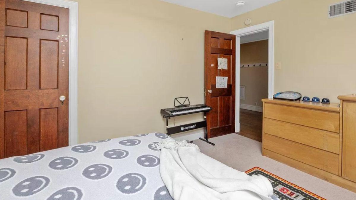 Simple Bedroom with Musical Touch and Warm Wood Tones