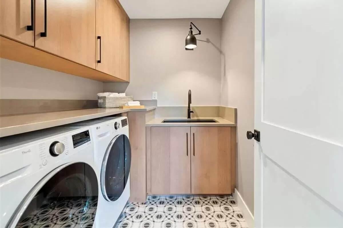 Efficient Laundry Space with Bold Geometric Flooring
