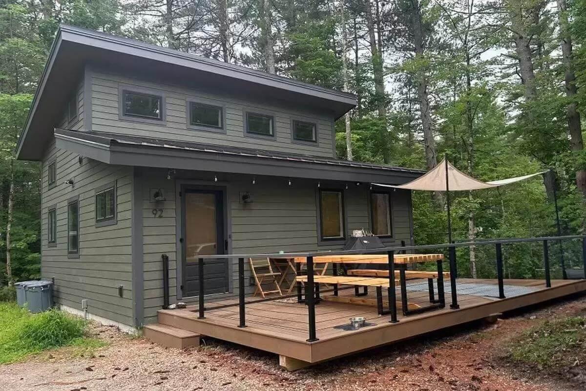 Take a Look at the Raised Deck with Its Sleek Railings on This Modern Cabin