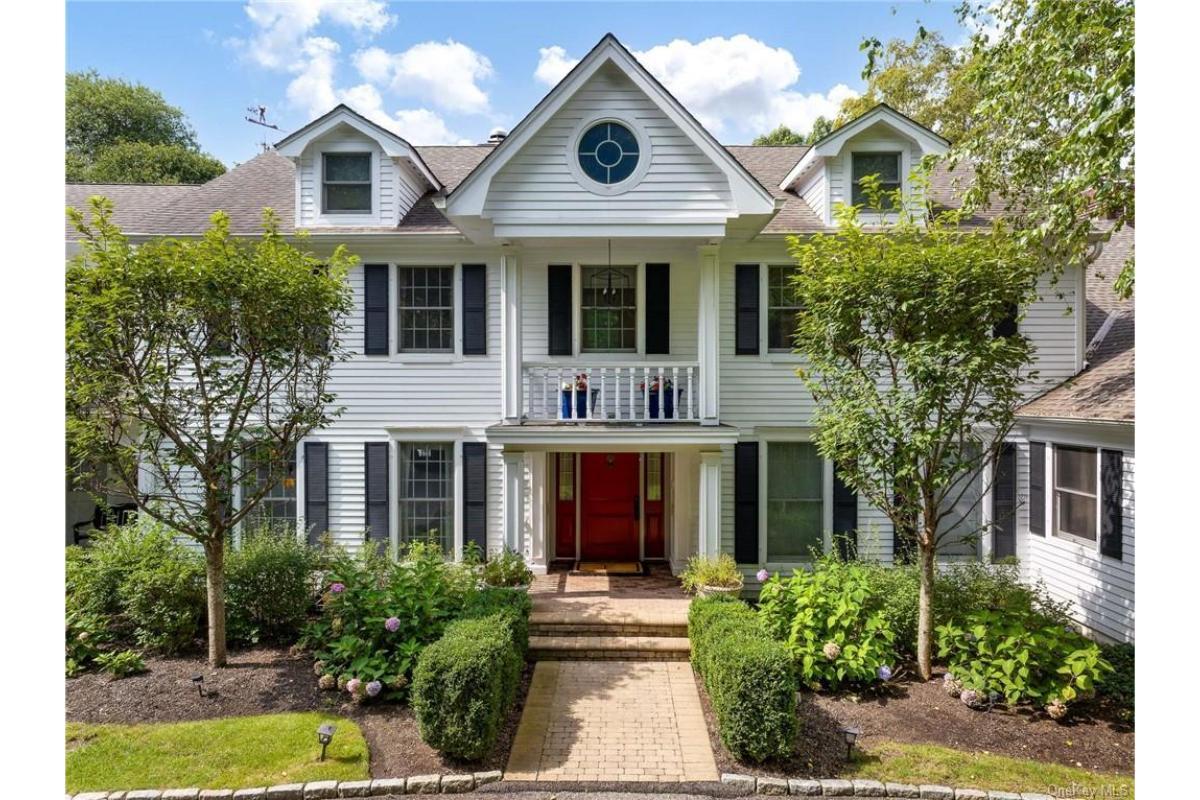 Classic Colonial Facade with a Striking Red Door