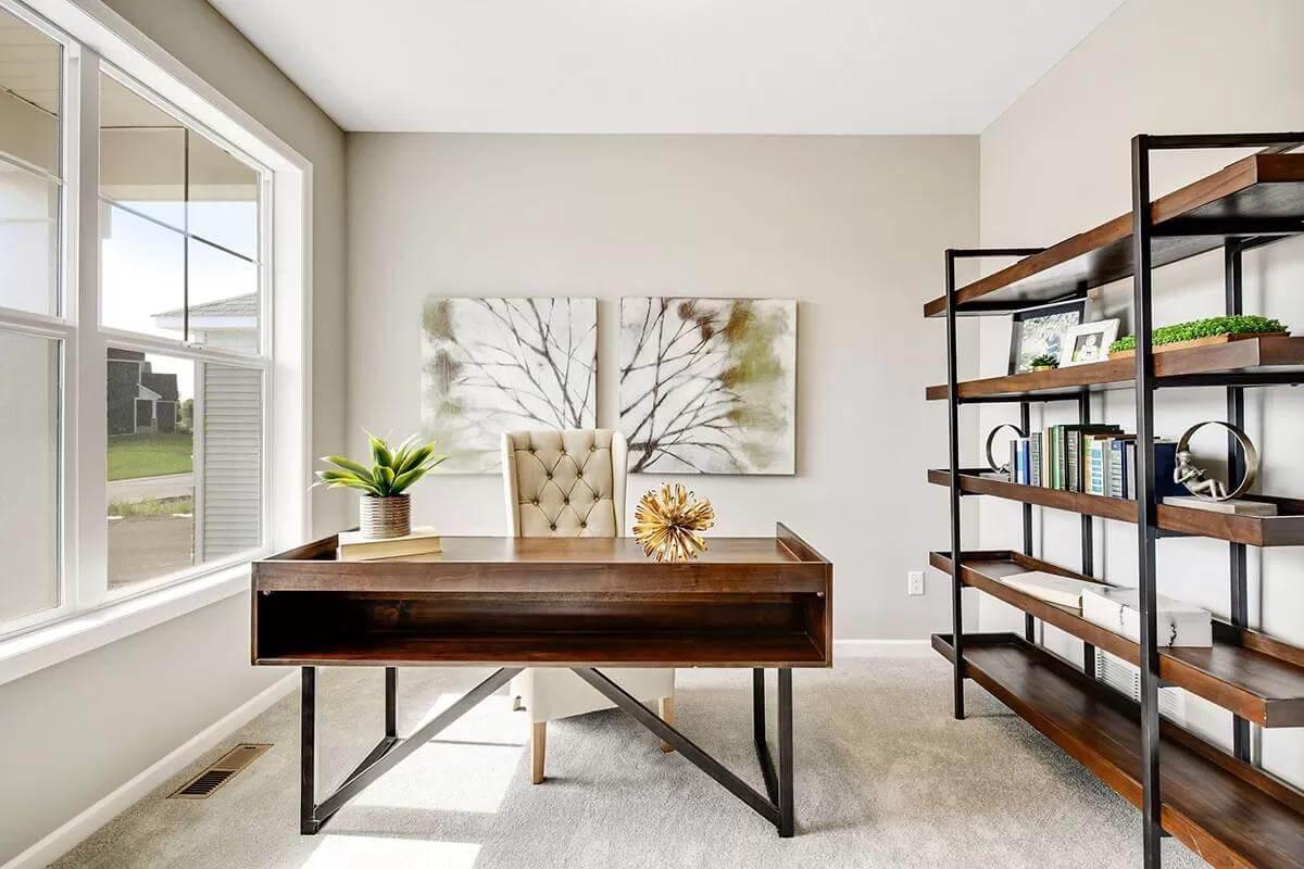 Chic Home Office with Expansive Bookcase Built for Organization