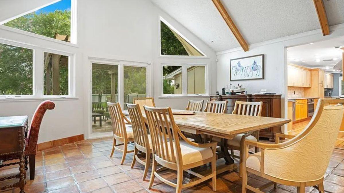 Rustic Dining Room with Exposed Beams and Bright Windows