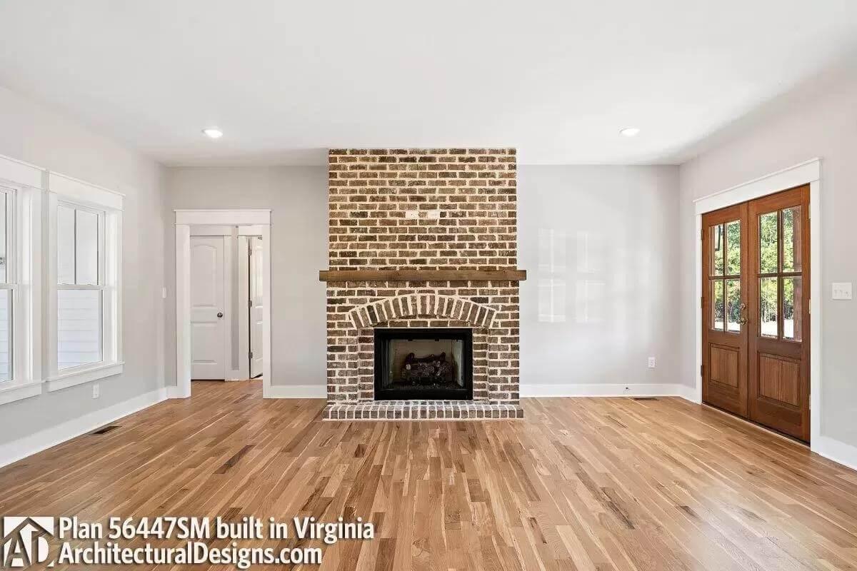 Warm Brick Fireplace Anchored in a Light-Filled Living Room