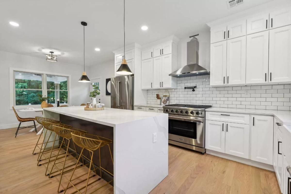 Wow, Look at This Kitchen Island with Gold Accents and a Crisp White Palette