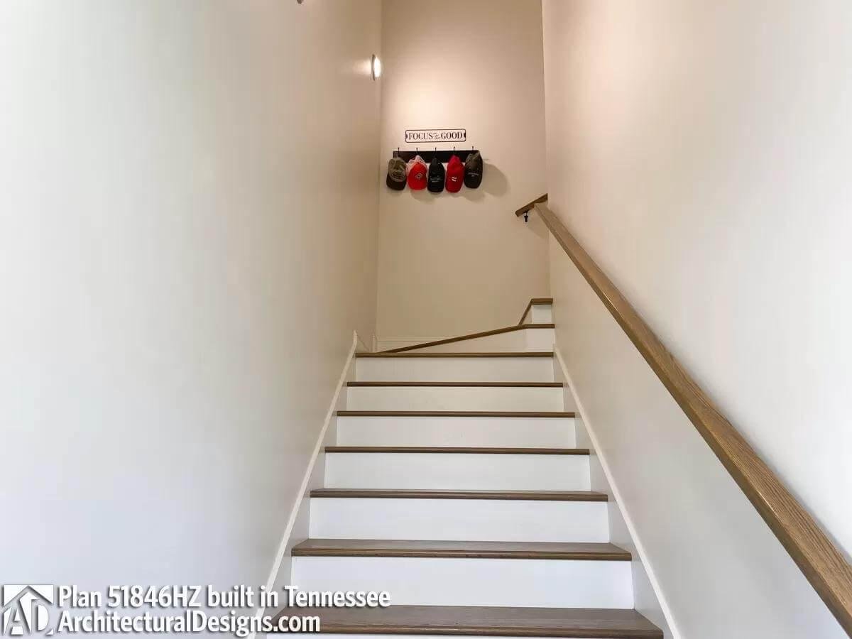 Functional Stairway with Neutral Tones and Personal Touches