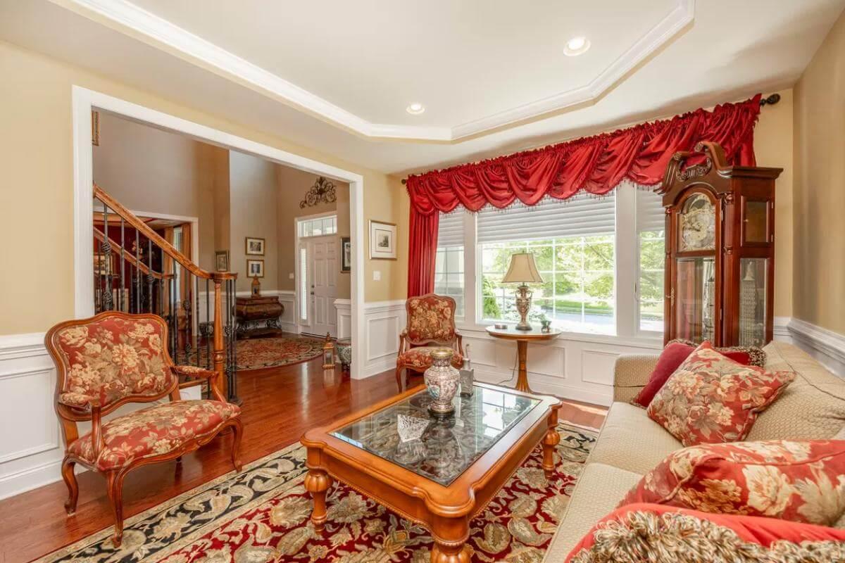 Classic Living Room with Timeless Furnishings and Elegant Red Accents