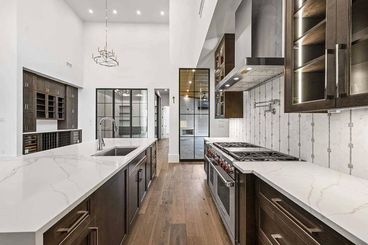 Wow, Check Out the Double Ovens and High Ceilings in This Sleek Kitchen
