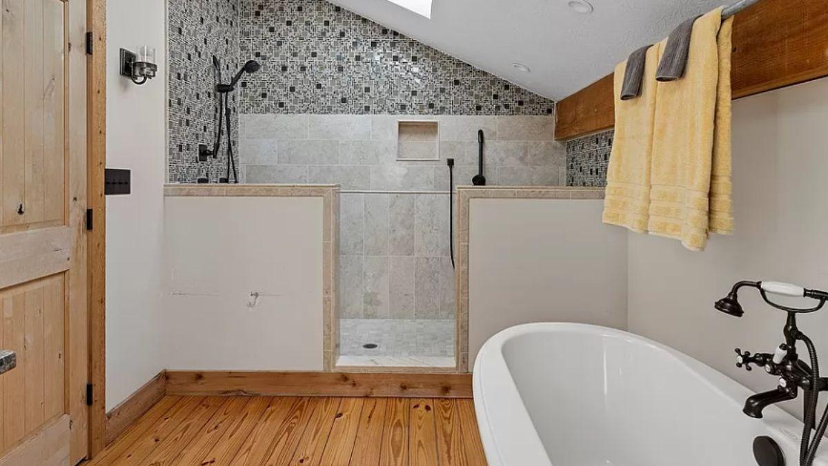 Notice the Unique Tile Work in This Inviting Rustic Bathroom