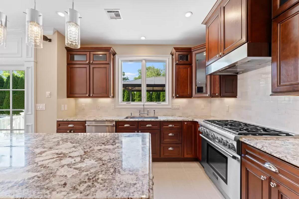 Check Out These Rich Wood Cabinets Highlighting a Gourmet Kitchen
