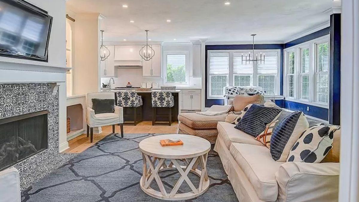 Open Concept Living with Stylish Blue Accents and Detailed Fireplace