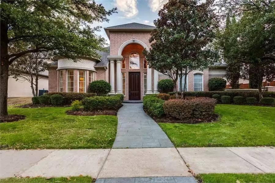 Grand Entrance with Arched Brick Detailing