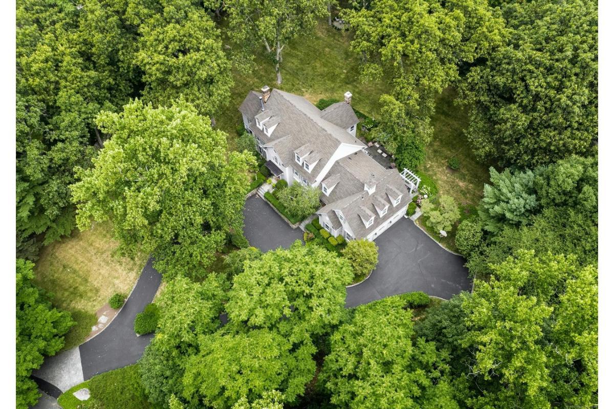 Discover This Colonial Gem Tucked Away in Verdant Surroundings
