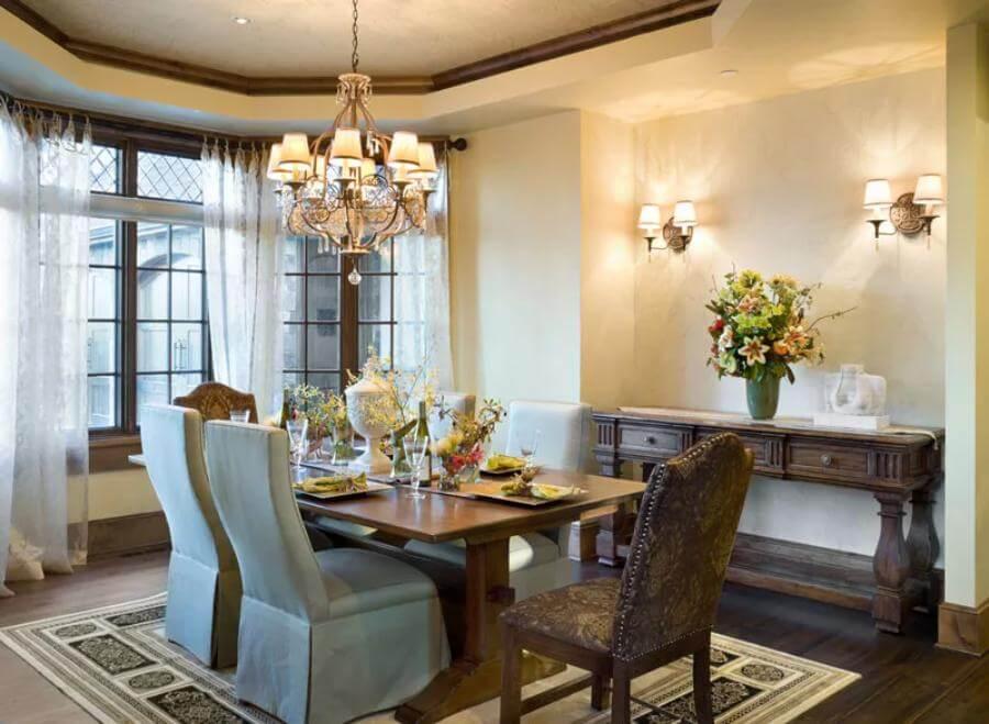 Elegant Dining Room with Antique Sideboard and Cozy Lighting