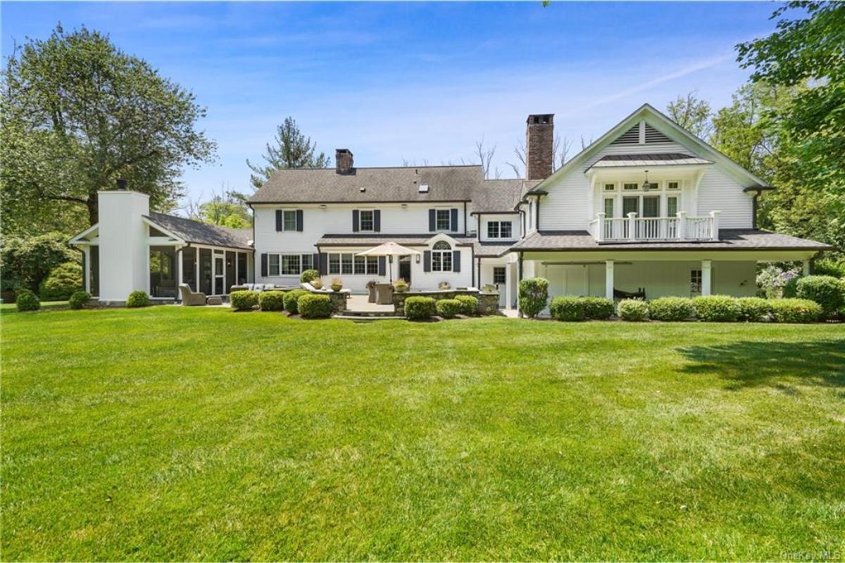 Expansive Lawn Leading to This Colonial’s Grand Back Patio