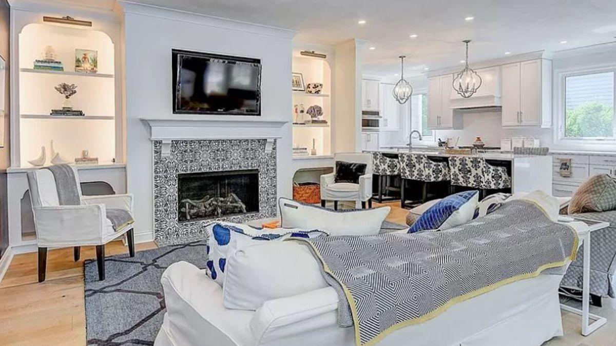 Modern Meets Classic in This Open-Concept Living Area with Artful Fireplace