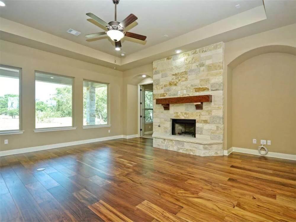 Notice the Stone Fireplace Paired with Gleaming Wood Floors
