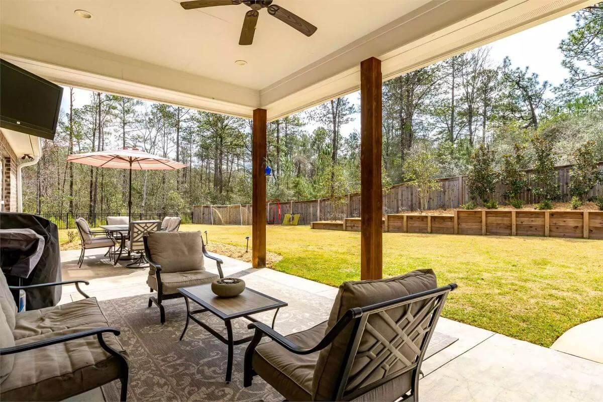 Spacious Covered Patio with Ceiling Fan for Breezy Outdoor Living