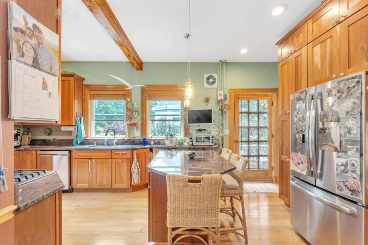 Check Out the Rattan Bar Stools in This Homey Kitchen Scene