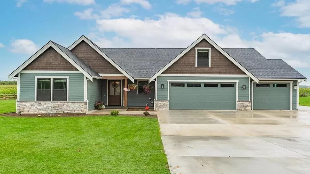 Charming Ranch Home with a Triple Garage and Stone Accents