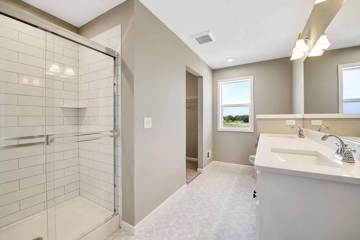 Bright Bathroom with Crisp Subway Tiles and Dual Vanity