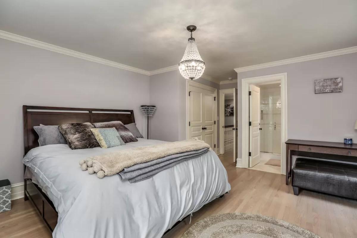 Relax in This Elegant Bedroom with a Crystal Chandelier