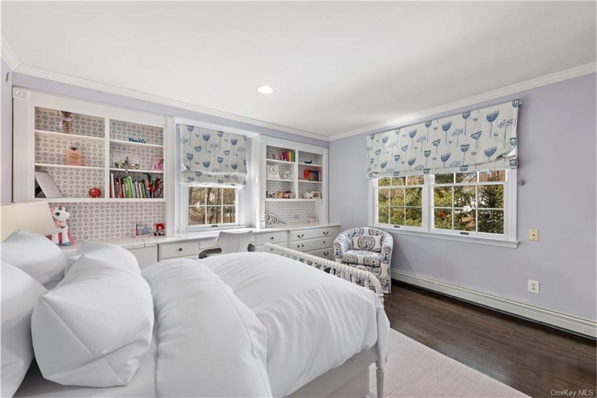 Notice the Delightful Built-In Shelves and Coordinating Roman Shades